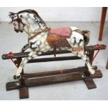 A dappled grey painted wooden rocking horse with wooden eyes, real hair mane,