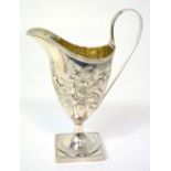 A George III hallmarked silver ewer shaped jug on pedestal base with high loop handle, London 1792,