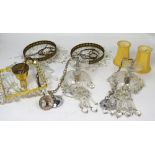 A quantity of cut glass and gilt metal light fittings, some with prism style drops.