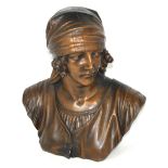 A large bronzed plaster bust of a young French woman in peasant dress, height 45cm.