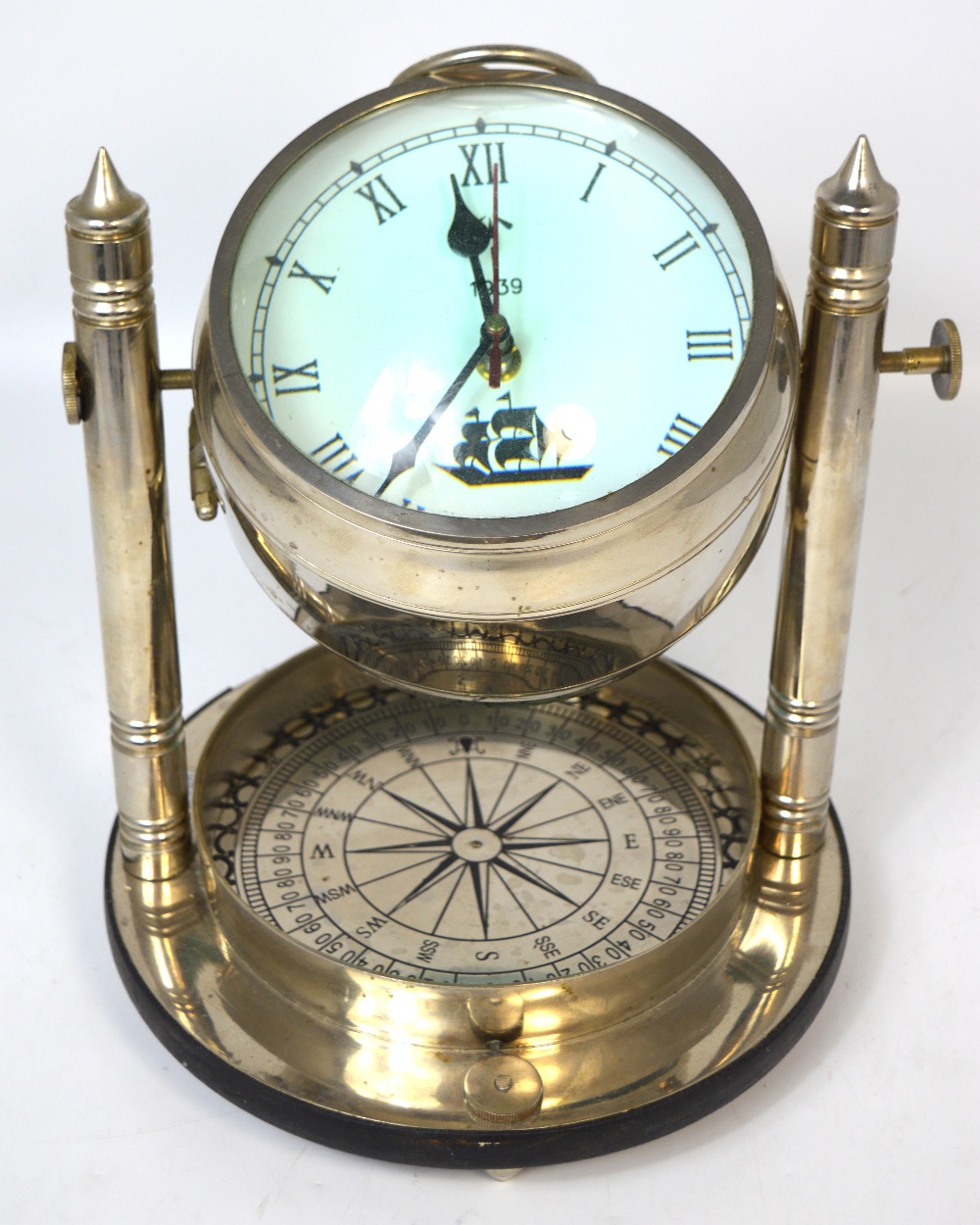 A contemporary chromed decorative combination table ship's clock/compass.