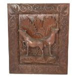 An Oriental carved wood panel featuring cows, among foliage with a highly decorated carved border,