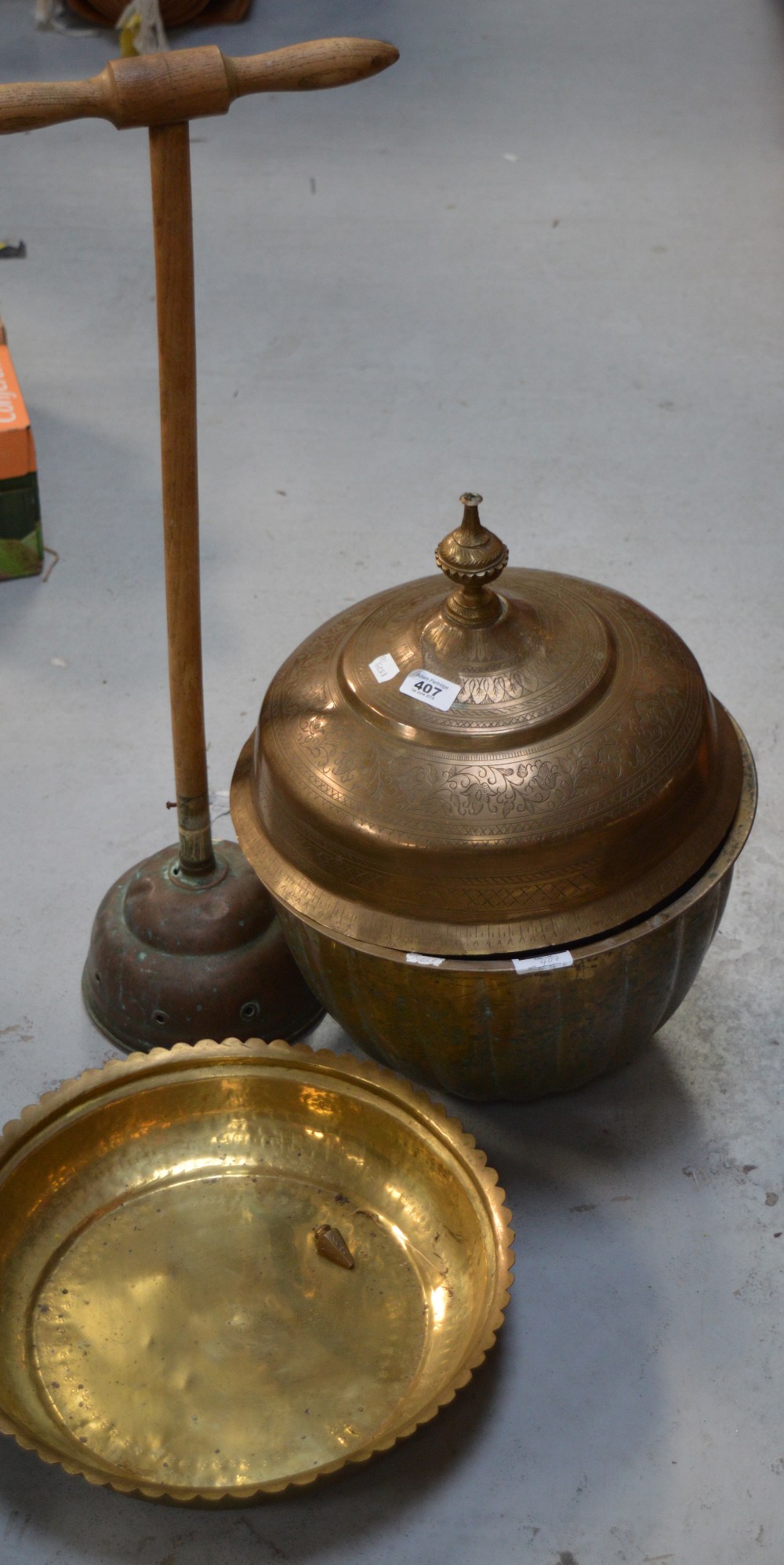 A quantity of brassware to include a large Indian platter with dome cover, a fire screen,