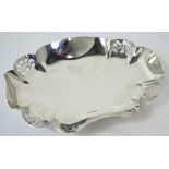 A George VI hallmarked silver shallow bowl the fluted and pierced rim on paw feet, Sheffield 1939,