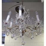 A six branch gilt metal and cut glass chandelier, height approx 55cm.