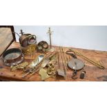 A quantity of copper and brass ware to include fire irons, weights,