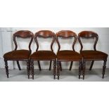 Four Victorian mahogany balloon back dining chairs on turned legs and peg feet (4).