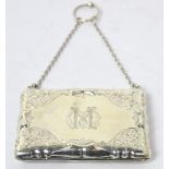 A George V hallmarked silver card case, aide-mémoire with engraved decoration and chain handle,