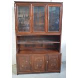 A Chinese hardwood display cabinet, with glazed doors enclosing adjustable shelves,