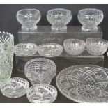 A quantity of crystal and cut glass to include vases, dessert bowls, rose bowls etc.