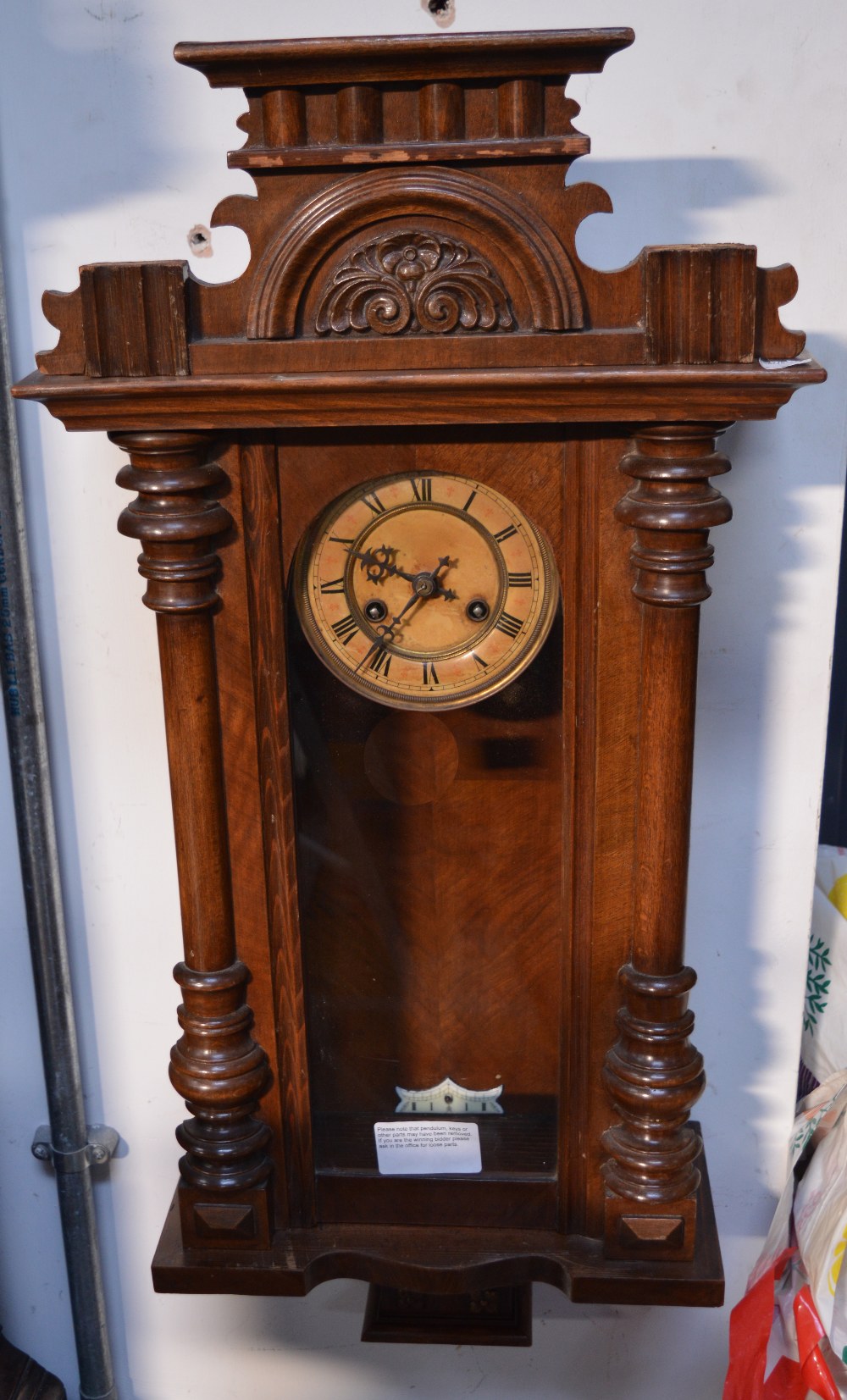 A reproduction Vienna style eight day wall clock, dial set with Roman numerals, height 86cm.