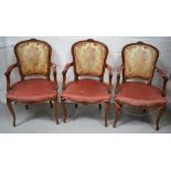 Three early 20th century walnut framed salon chairs upholstered in pink velvet and Aubusson style