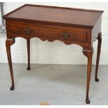 A walnut side table with long single drawer on pad feet, width 84cm.