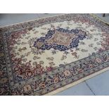 A reproduction beige ground Tabriz carpet, 280 x 200cm.
