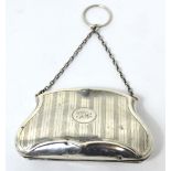 A hallmarked silver engine turned purse with chain handle,