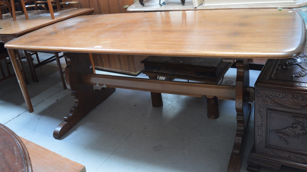 An Ercol refectory table on twin end slab supports, length approx 78cm.