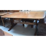 An Ercol refectory table on twin end slab supports, length approx 78cm.