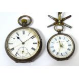 A silver crown wind open face pocket watch,