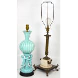 A gilt metal table lamp with fluted column support on ebonised square section base with four