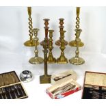A quantity of metalware to include brass and copper candlesticks, plated flatware etc.