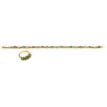 A 9ct yellow gold bracelet wet with green stones, all within a border of small white stones,