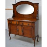 An oak mirror back sideboard,