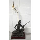 An Oriental lamp with double light in the form of a Siamese musician on a raised metal plinth