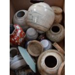 A quantity of Oriental ceramics to include Chinese provincial jars and covers.