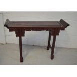 A Chinese carved hardwood altar table, width 125cm.