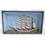 An early 20th century diorama of a four-masted vessel, 38 x 66cm.