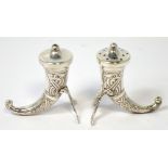 A Norwegian silver salt and pepper set in the form of hunting horns,