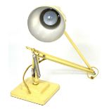 A retro cream anglepoise lamp.