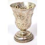 A silver repoussé vase on pedestal base with fruit and swag decoration, marks to the base, approx 1.
