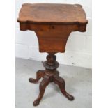 A 19th century burr walnut sewing table on carved quatrefoil support, height 77cm.