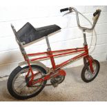 A vintage Raleigh Tomahawk red painted child's bicycle.