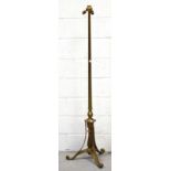 An early 20th century brass triple light standard lamp on trefoil support height 150cm.