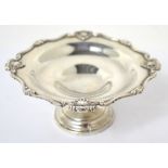 A George V hallmarked silver shallow bowl on footed base, Birmingham 1927, maker A.H.S.