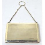 A hallmarked silver card case, aide-mémoire with chain handle, Birmingham, date marks rubbed,