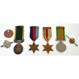 Four medals; a Territorial Army Efficient Service medal, a 1935-1945 Defence Medal,