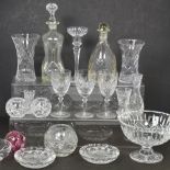 A quantity of cut glass and crystal to include bowls, vases, decanters and a candlestick.