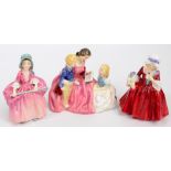 A Royal Doulton figure group HN2059 "The Bedtime Story" and two figures;