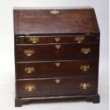 An early 19th century oak bureau,