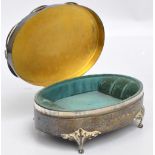 An Edward VII hallmarked silver jewellery box of oval form with floral and cast decoration to the