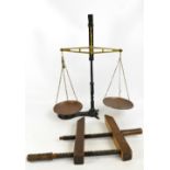 A green painted wrought iron and brass set of balance scales stamped "C.W.S.