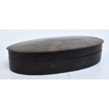 A 19th century tortoiseshell snuff box of plain oval form with detachable lid, 12 x 7 x 2.5cm.