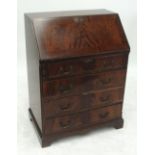 A reproduction crossbanded mahogany bureau,