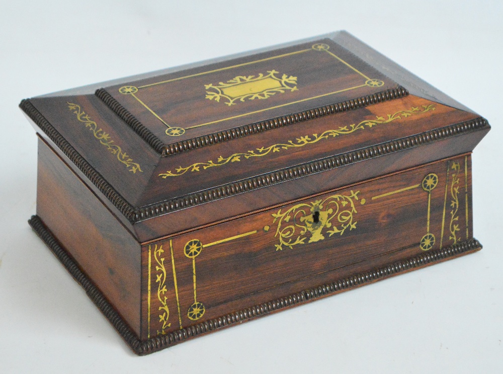 A Regency rosewood and brass inlaid work box with hinged lid, width 30.5cm.