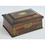 A Regency rosewood and brass inlaid work box with hinged lid, width 30.5cm.