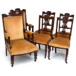 An Edwardian six-piece mahogany framed salon suite comprising gentleman's elbow chair,