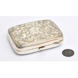 A Victorian hallmarked silver purse of rounded rectangular form with overall engraved foliate